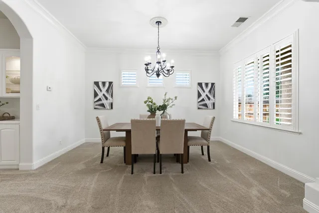 a kitchen with stainless steel appliances a sink and cabinets