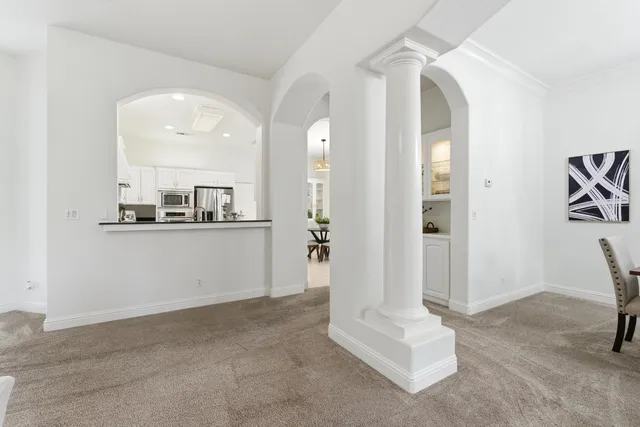a living room with furniture and white walls