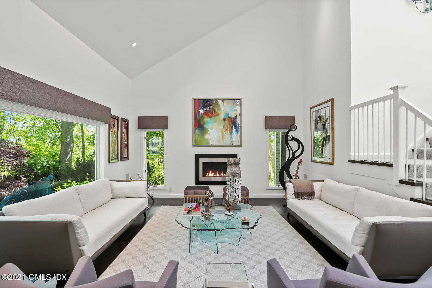 1 Old Church Road, Unit 7 Greenwich, CT 06830 - Photo 12 of 42 a living room with furniture a fireplace and a large window
