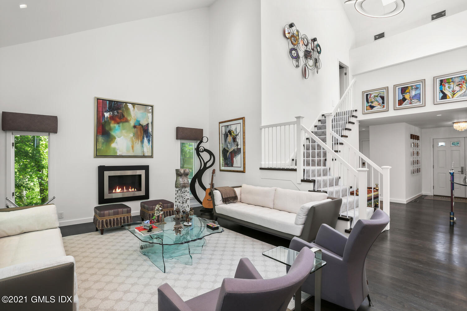 1 Old Church Road, Unit 7 Greenwich, CT 06830 - Photo 13 of 42 a living room with furniture a fireplace and a chandelier