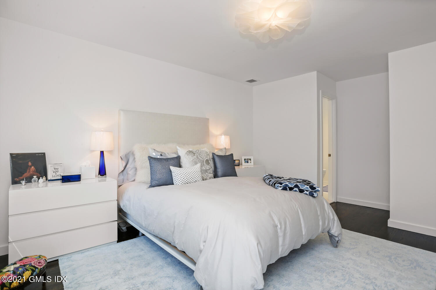 1 Old Church Road, Unit 7 Greenwich, CT 06830 - Photo 27 of 42 a bedroom with a bed and a closet