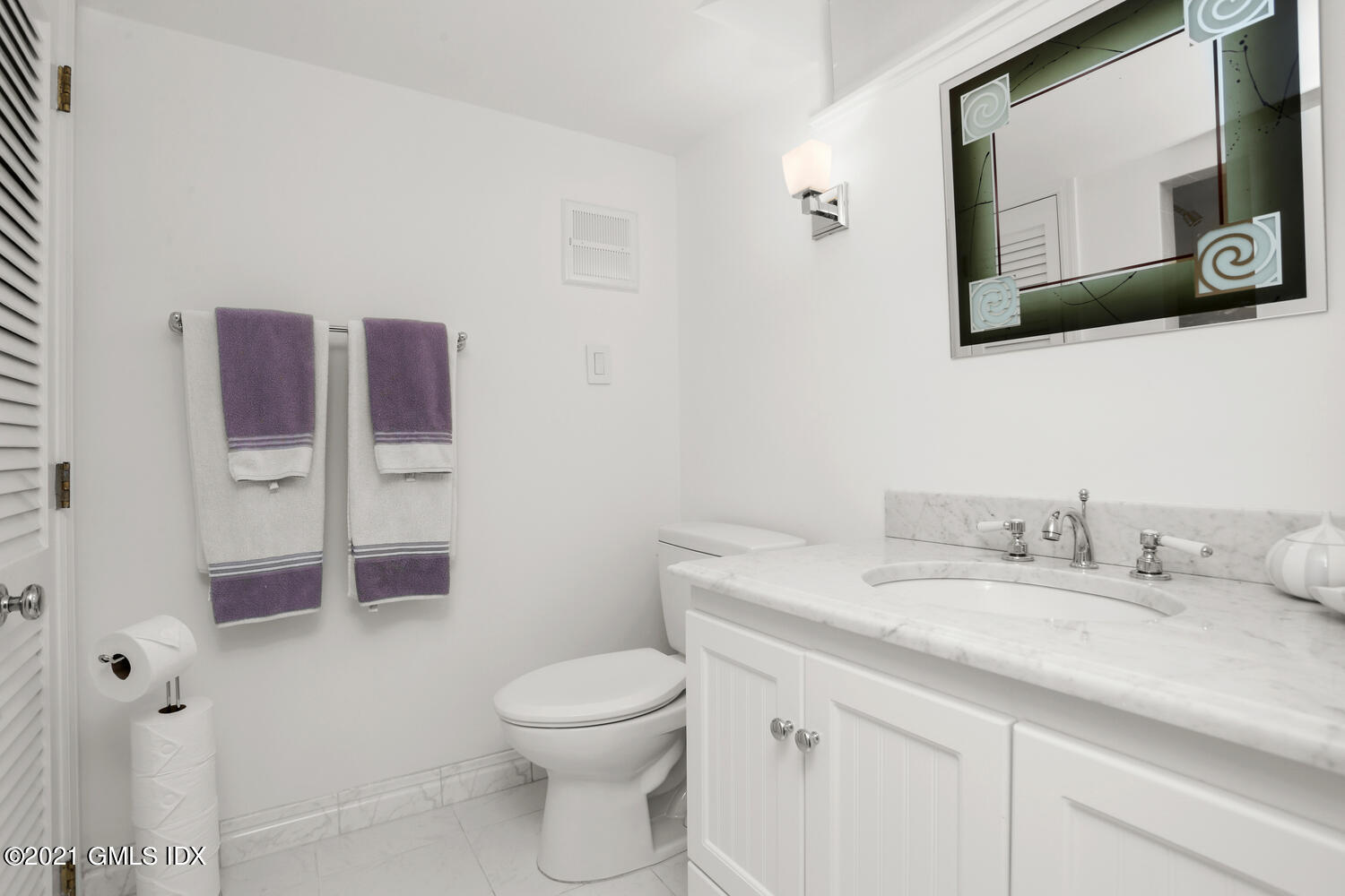 1 Old Church Road, Unit 7 Greenwich, CT 06830 - Photo 31 of 42 a bathroom with a toilet a sink and mirror