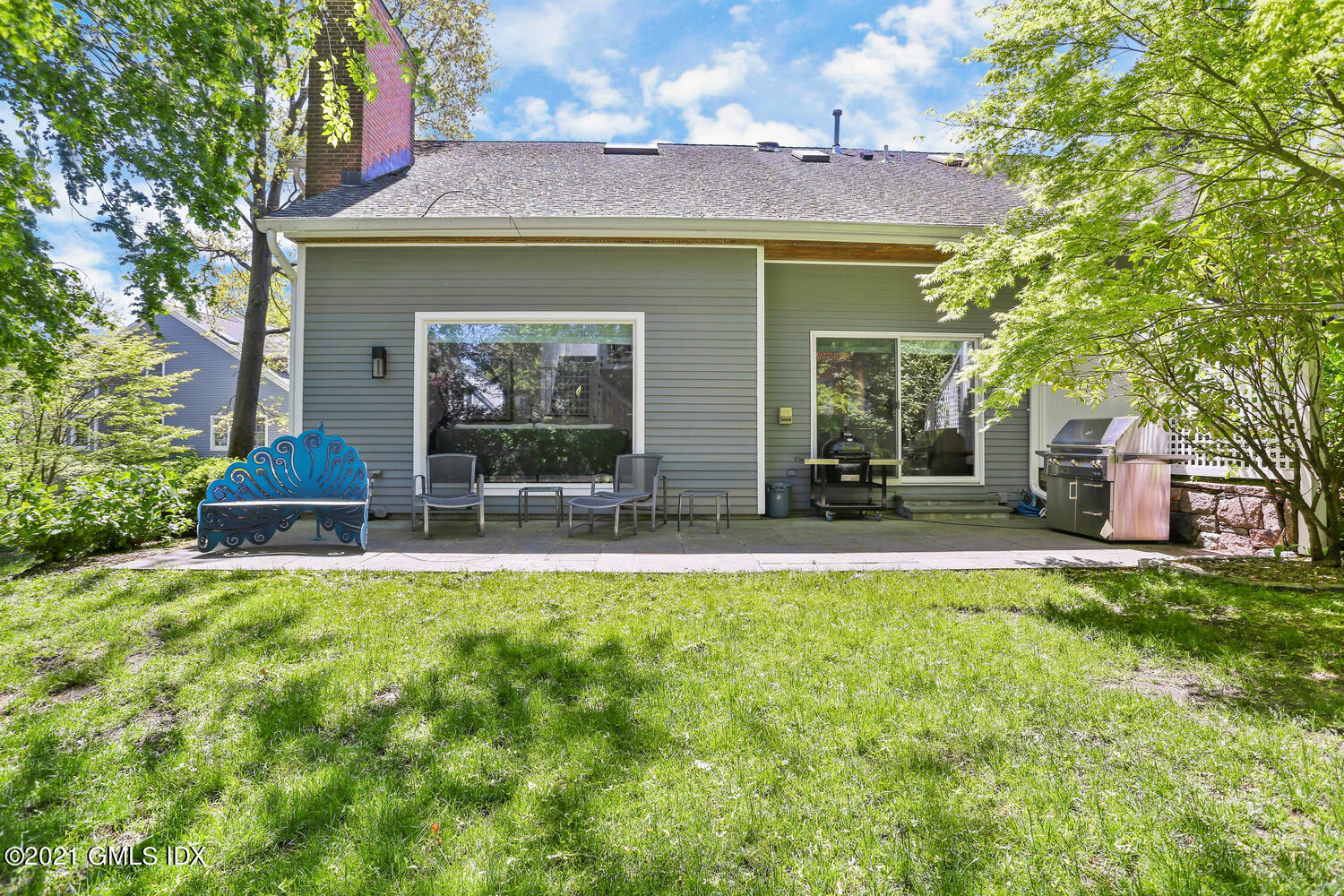 1 Old Church Road, Unit 7 Greenwich, CT 06830 - Photo 36 of 42 a view of a house with a yard potted plants and large tree
