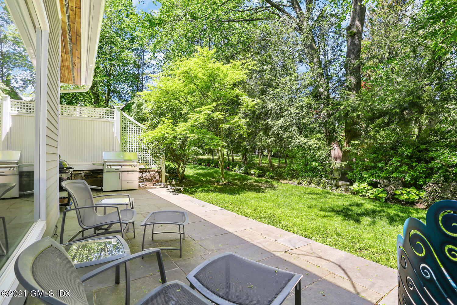 1 Old Church Road, Unit 7 Greenwich, CT 06830 - Photo 39 of 42 a view of a chairs and table in backyard