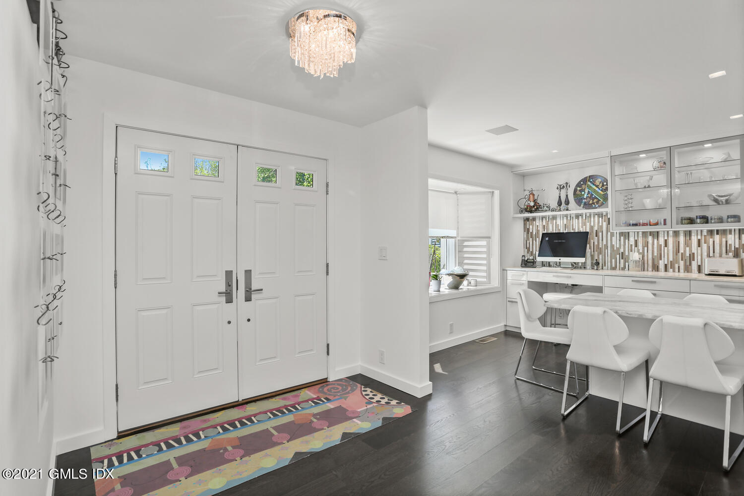 1 Old Church Road, Unit 7 Greenwich, CT 06830 - Photo 4 of 42 a view of a livingroom with furniture wooden floor a flat screen tv and windows