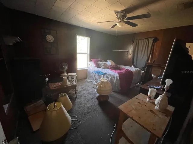 a bed room with furniture and a chandelier