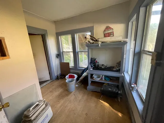 a bedroom with a bed and a mirror