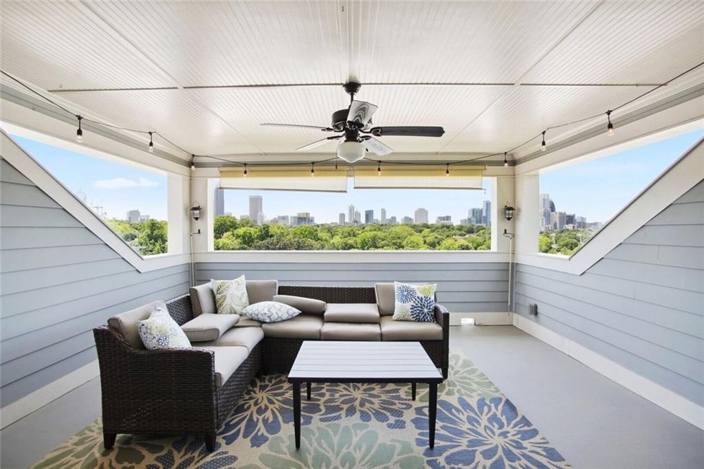 692 Drewry Street Northeast Atlanta, GA 30306 - Photo 22 of 25 a view of a balcony with furniture and a floor to ceiling window