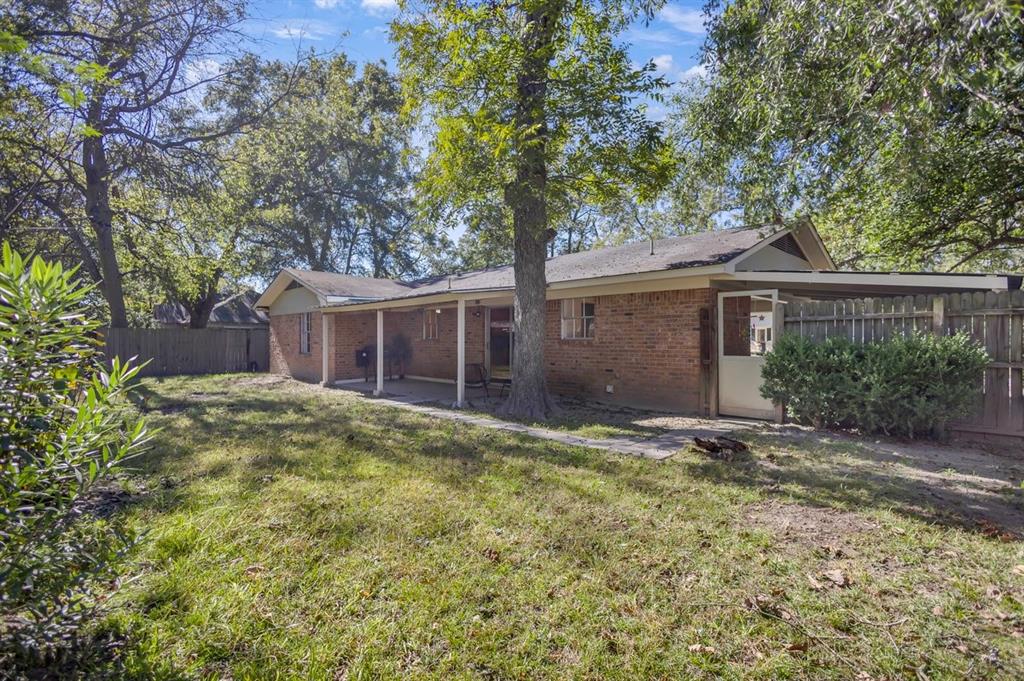 815 North Bledsoe Street Gilmer, TX 75644 - Photo 24 of 26 a view of a house with a yard