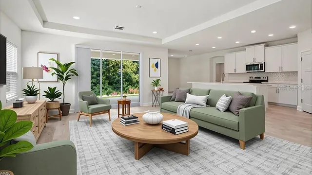 a living room with furniture and a large window