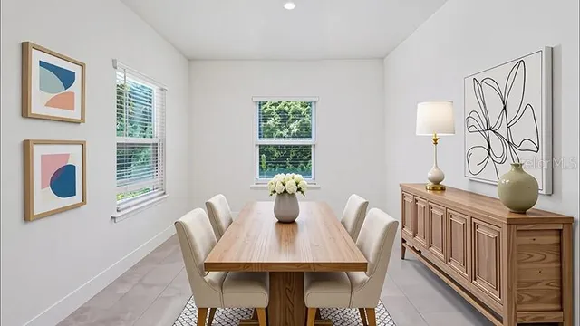 a view of a dining room with furniture window and outside view