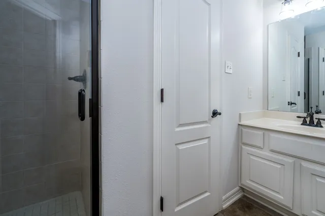 a bathroom with a sink and mirror