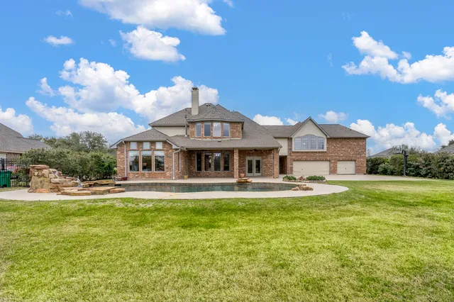 a view of swimming pool with outdoor seating
