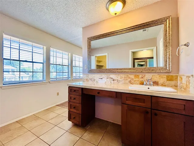 a bathroom with a toilet and a bathtub