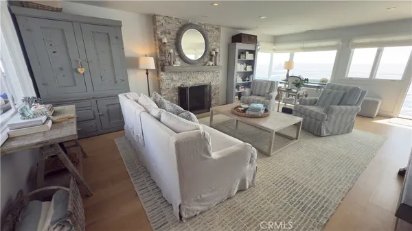 a living room with fireplace furniture and a fireplace
