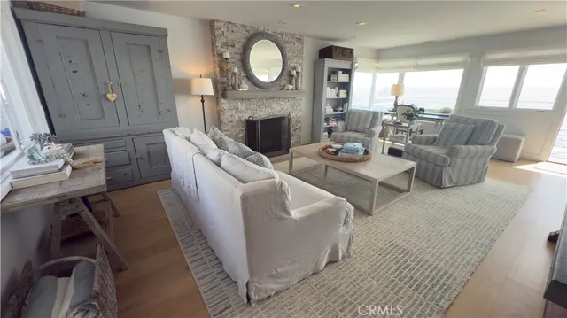 a living room with fireplace furniture and a fireplace