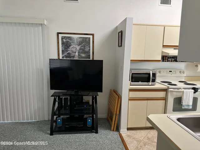 a kitchen with a appliances and cabinets