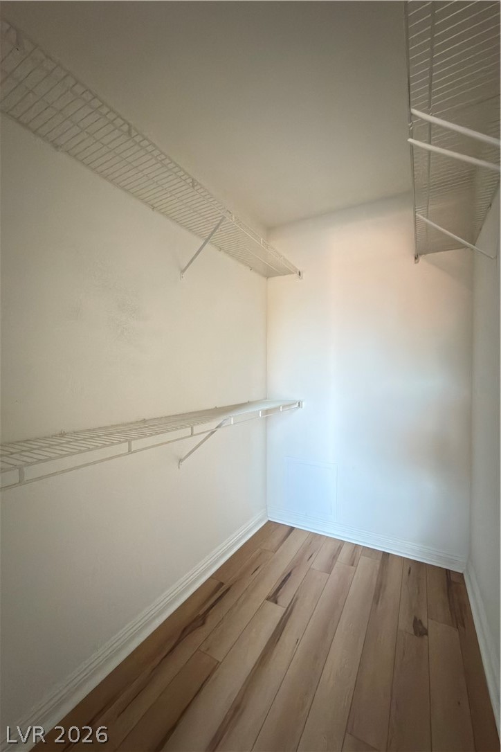 8101 West Flamingo Road, Unit 2131 Las Vegas, NV 89147 - Photo 6 of 13 Hardwood floors and wire shelving maximize storage in this well-organized closet.