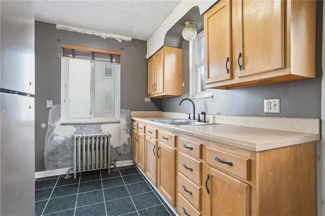 an empty room with windows and closet