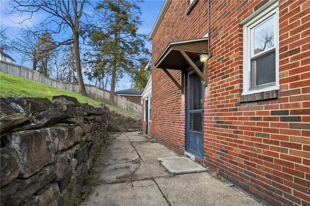 a view of a house with a bench