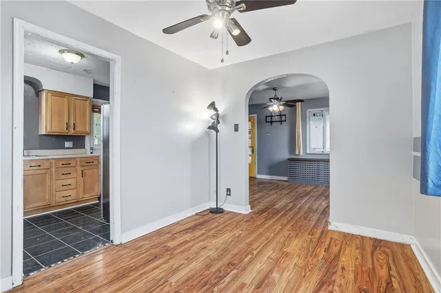 a view of a hallway view with wooden floor and staircase