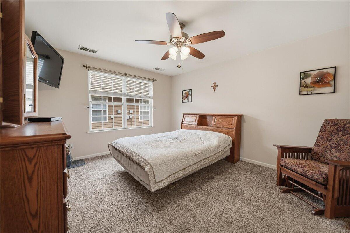 352 West 43rd Court Griffith, IN 46319 - Photo 11 of 19 a bedroom with a bed and a flat screen tv