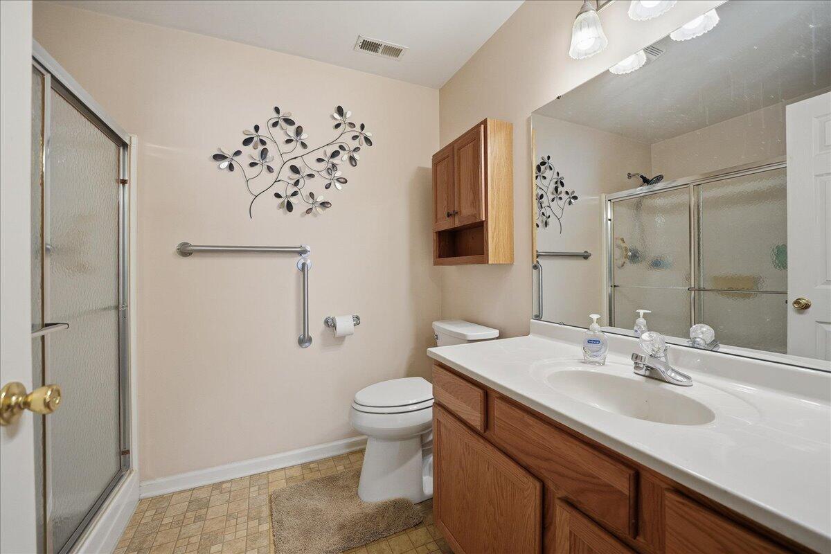 352 West 43rd Court Griffith, IN 46319 - Photo 13 of 19 a bathroom with a sink toilet and shower