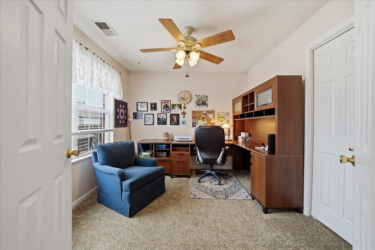 352 West 43rd Court Griffith, IN 46319 - Photo 8 of 19 a work room with furniture and a ceiling fan