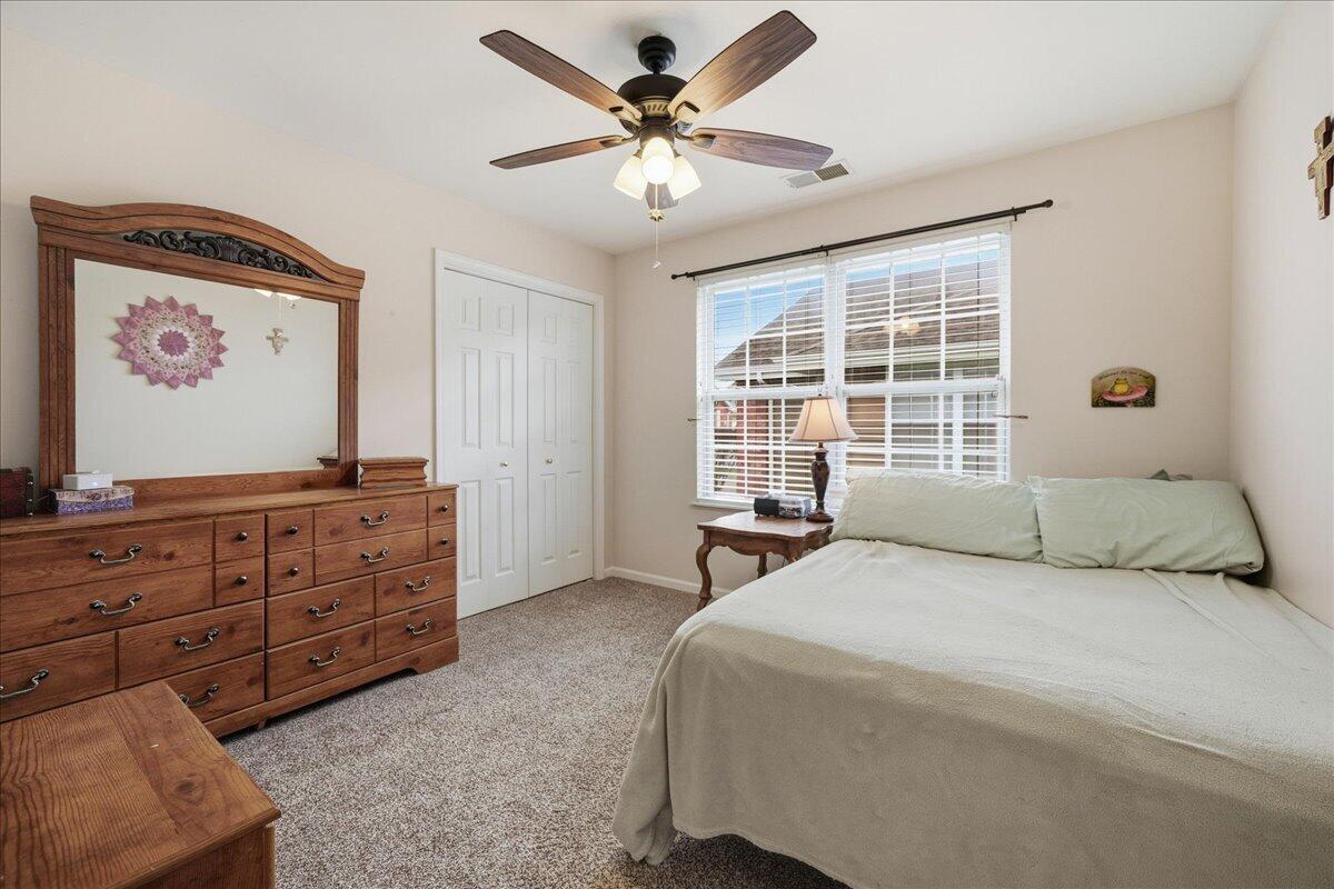 352 West 43rd Court Griffith, IN 46319 - Photo 9 of 19 a bedroom with a bed dresser and a window