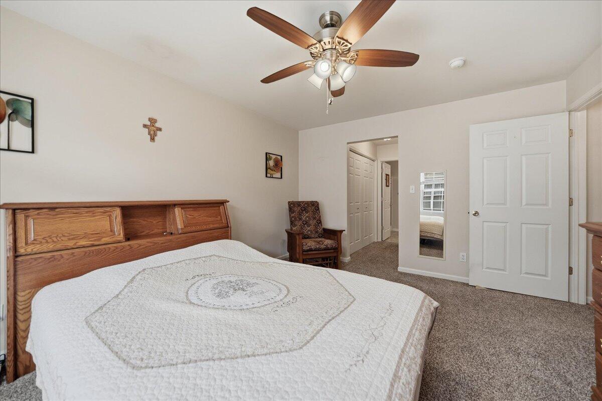 352 West 43rd Court Griffith, IN 46319 - Photo 10 of 19 a bedroom with a bed and a chandelier
