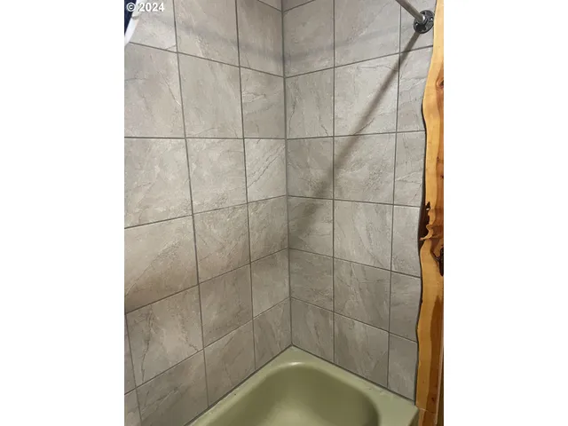 a bedroom with a bed and a closet