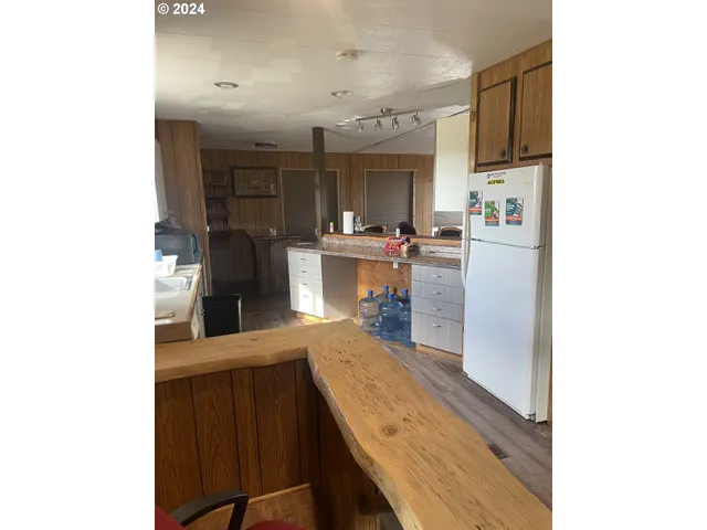 a kitchen with counter top space and stainless steel appliances
