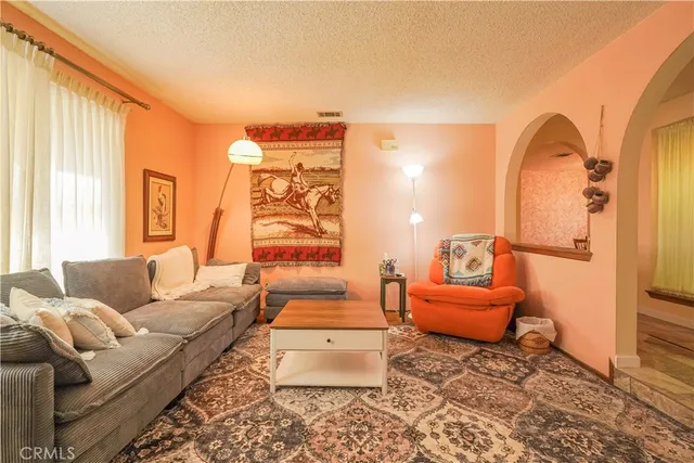 a living room with furniture and a window