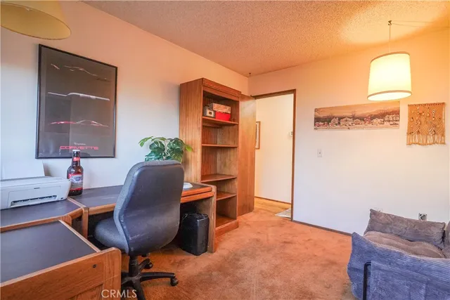 a workspace with furniture and a window