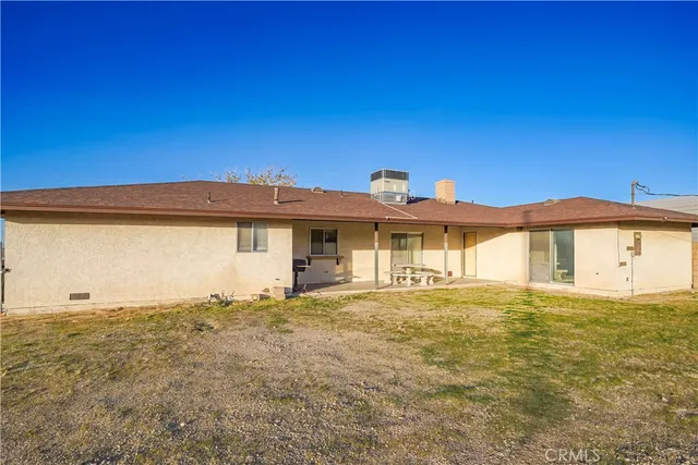 a view of a big house with a big yard