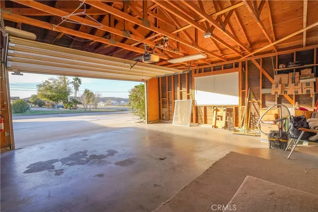 a view of a patio with table and chairs