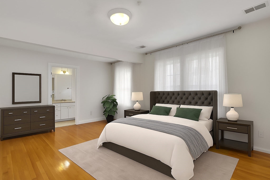 66 Webster Street, Unit 66 Newton, MA 02465 - Photo 18 of 40 a spacious bedroom with a bed and window