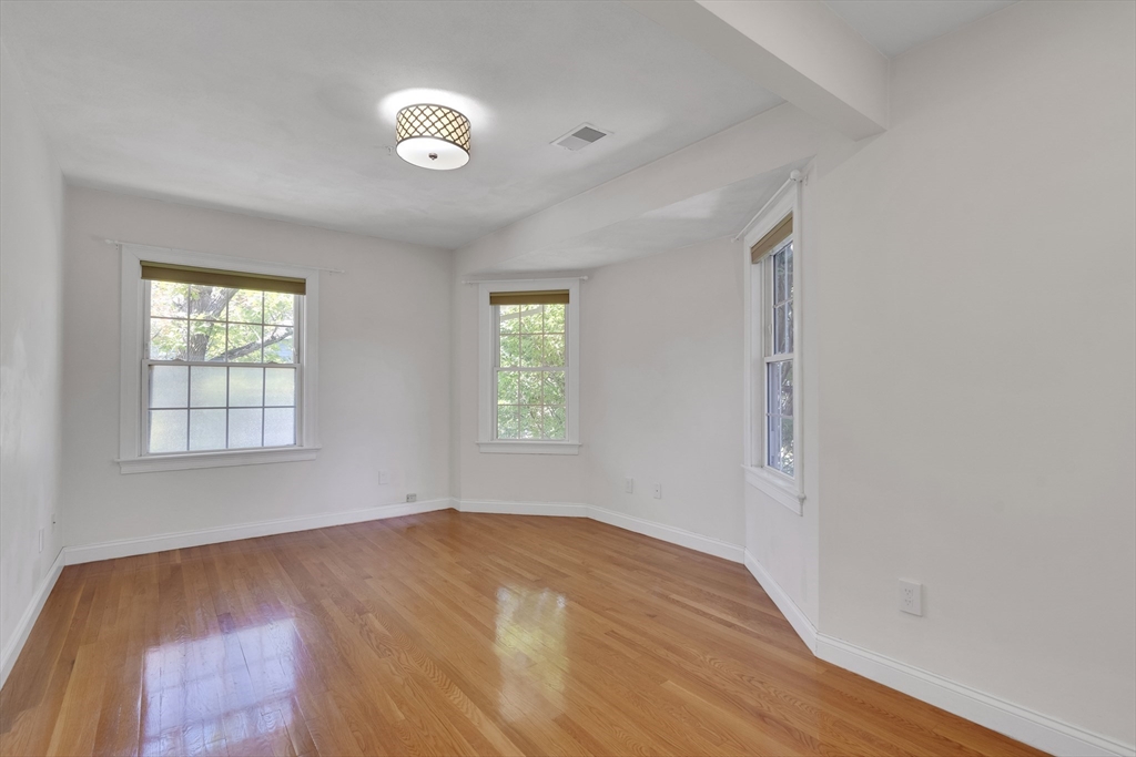 66 Webster Street, Unit 66 Newton, MA 02465 - Photo 23 of 40 an empty room with windows and closet