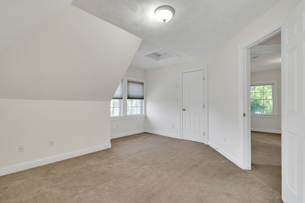 66 Webster Street, Unit 66 Newton, MA 02465 - Photo 27 of 40 an empty room with windows