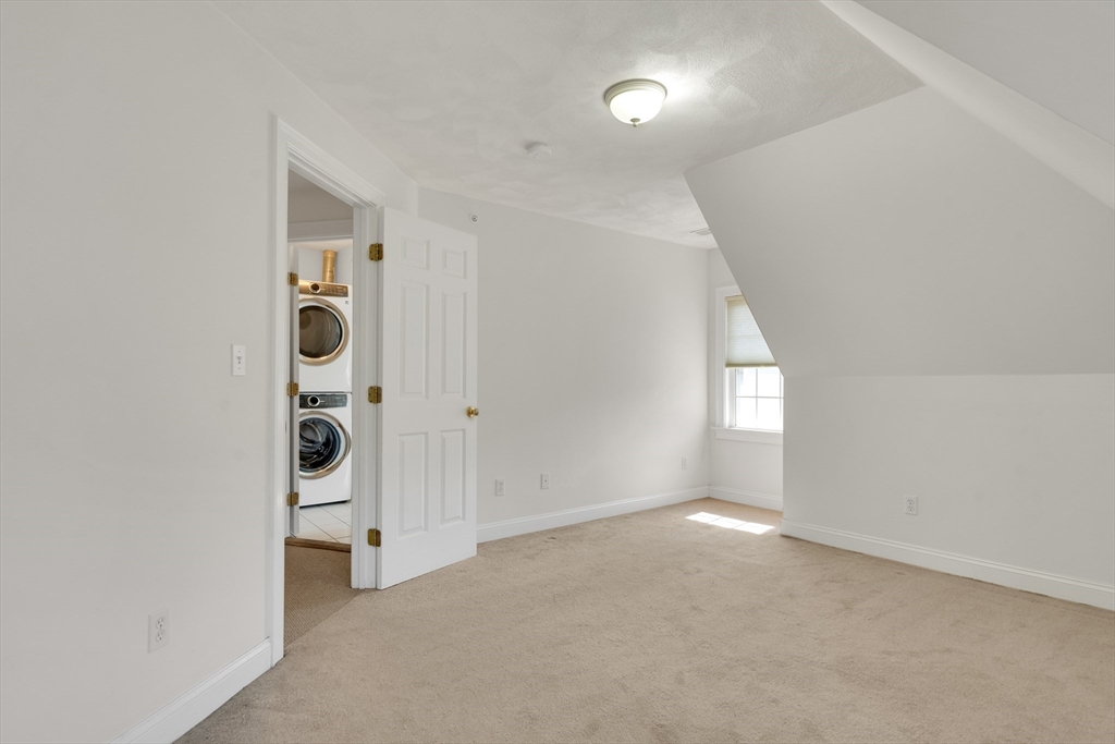 66 Webster Street, Unit 66 Newton, MA 02465 - Photo 28 of 40 an empty room with windows and closet