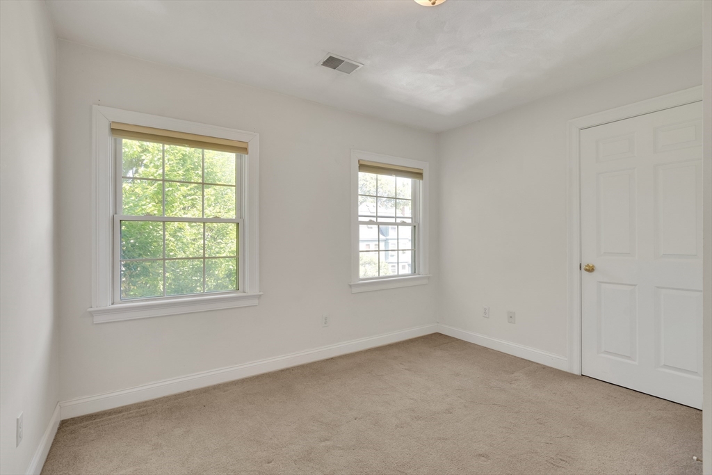66 Webster Street, Unit 66 Newton, MA 02465 - Photo 29 of 40 a view of an empty room with a window