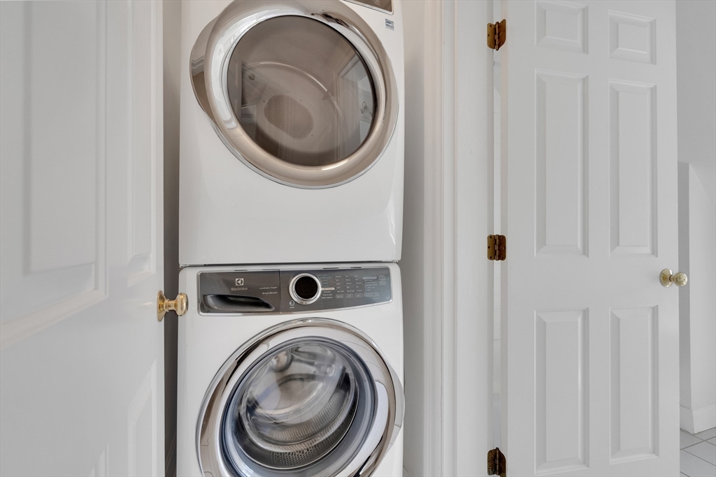 66 Webster Street, Unit 66 Newton, MA 02465 - Photo 30 of 40 a utility room with dryer and washer