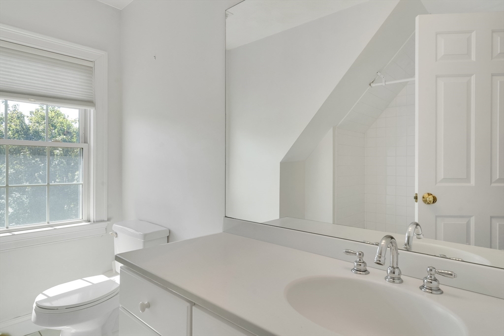 66 Webster Street, Unit 66 Newton, MA 02465 - Photo 31 of 40 a bathroom with a sink toilet and vanity