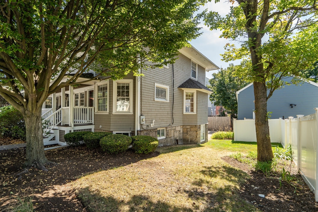 66 Webster Street, Unit 66 Newton, MA 02465 - Photo 36 of 40 a front view of a house with a yard
