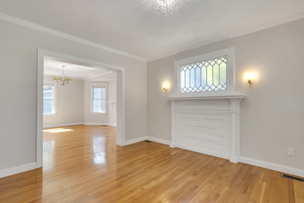 66 Webster Street, Unit 66 Newton, MA 02465 - Photo 6 of 40 a view of empty room with wooden floor and fan
