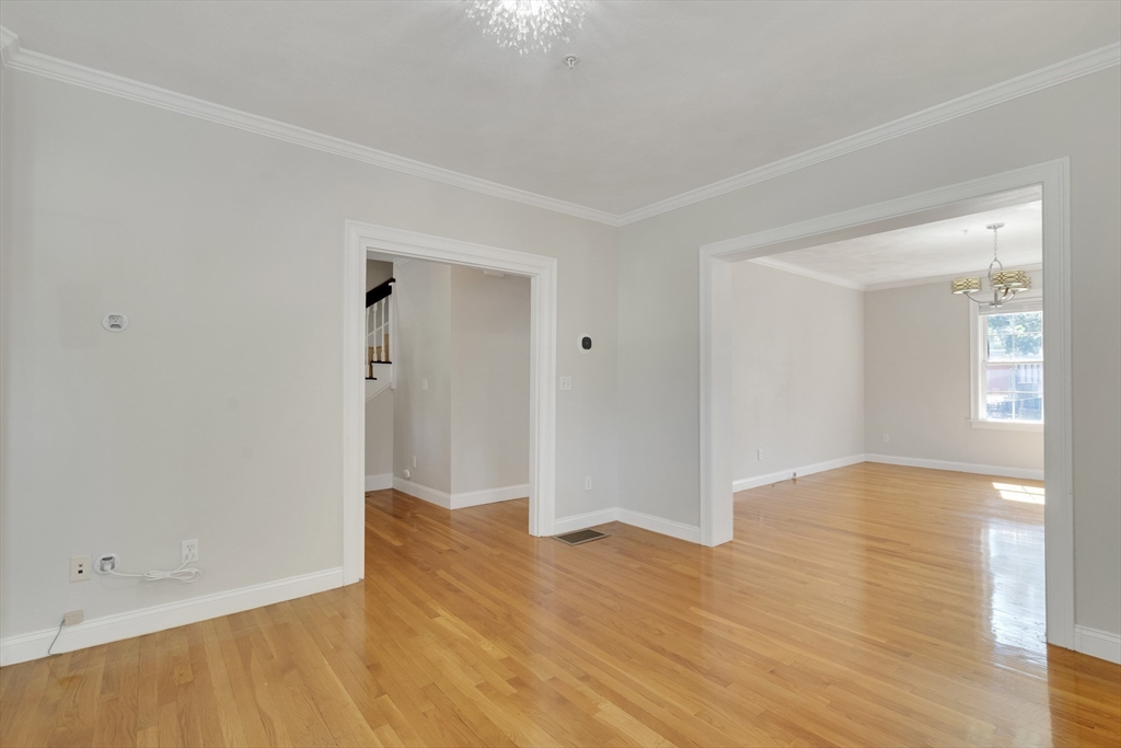 66 Webster Street, Unit 66 Newton, MA 02465 - Photo 7 of 40 wooden floor in an empty room