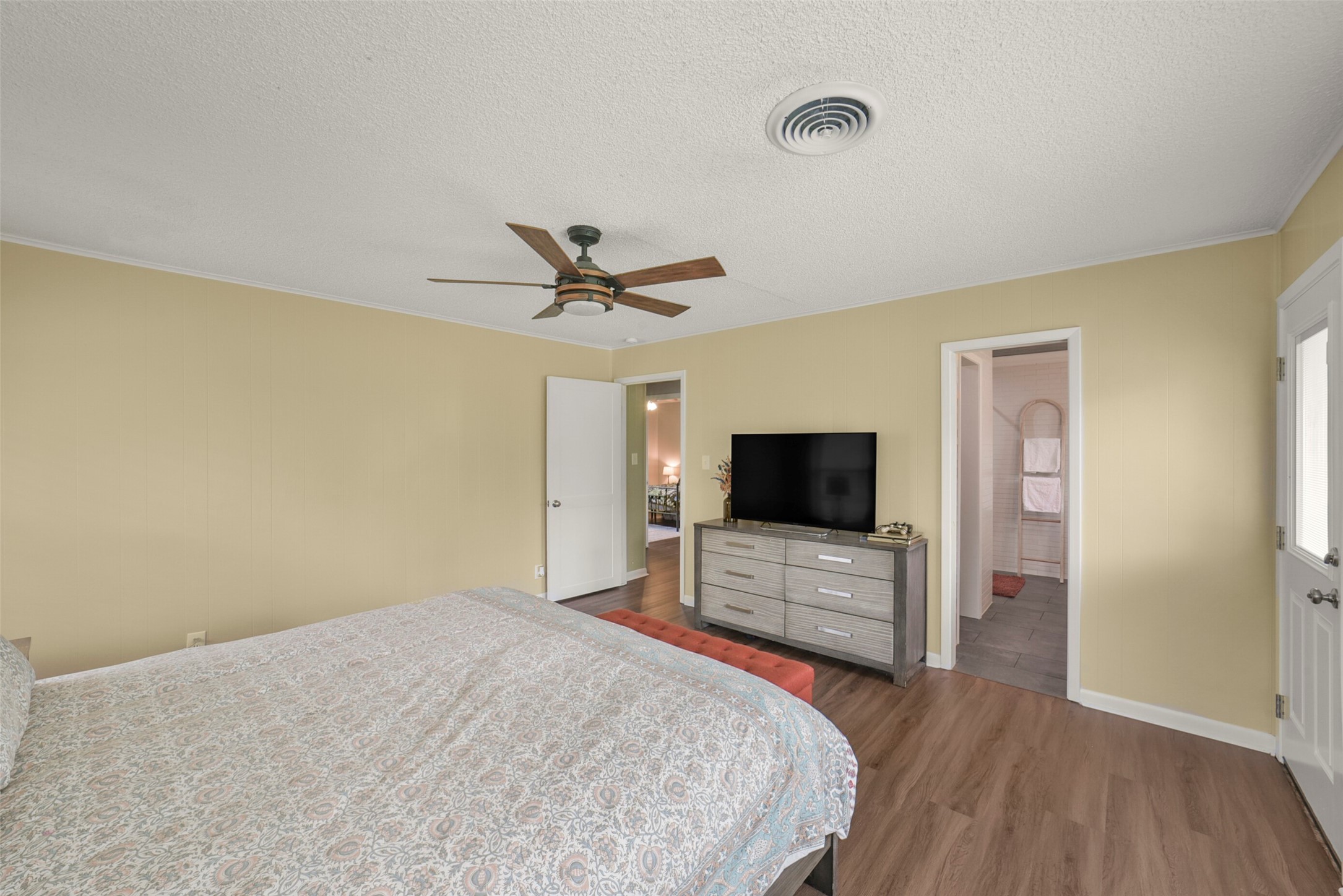 10313 South Williams Road Conroe, TX 77303 - Photo 24 of 48 Another view of the primary bedroom, looking into the primary bathroom.