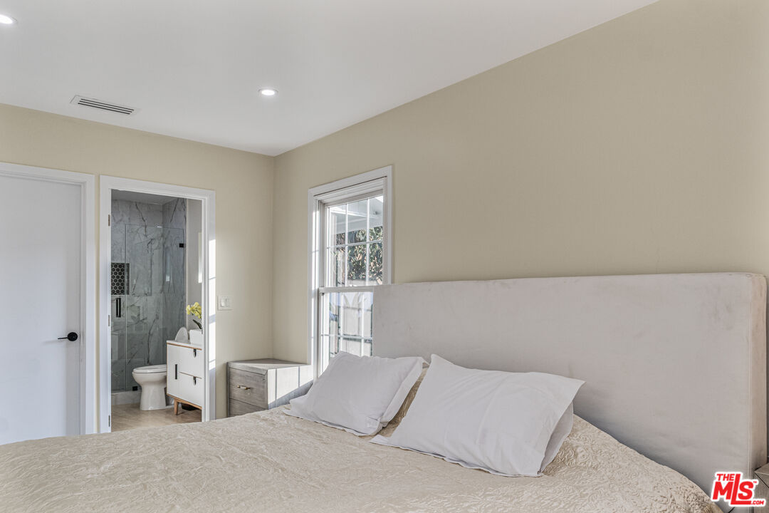 3500 Tuller Avenue Los Angeles, CA 90034 - Photo 13 of 20 a bedroom with a bed and a couch