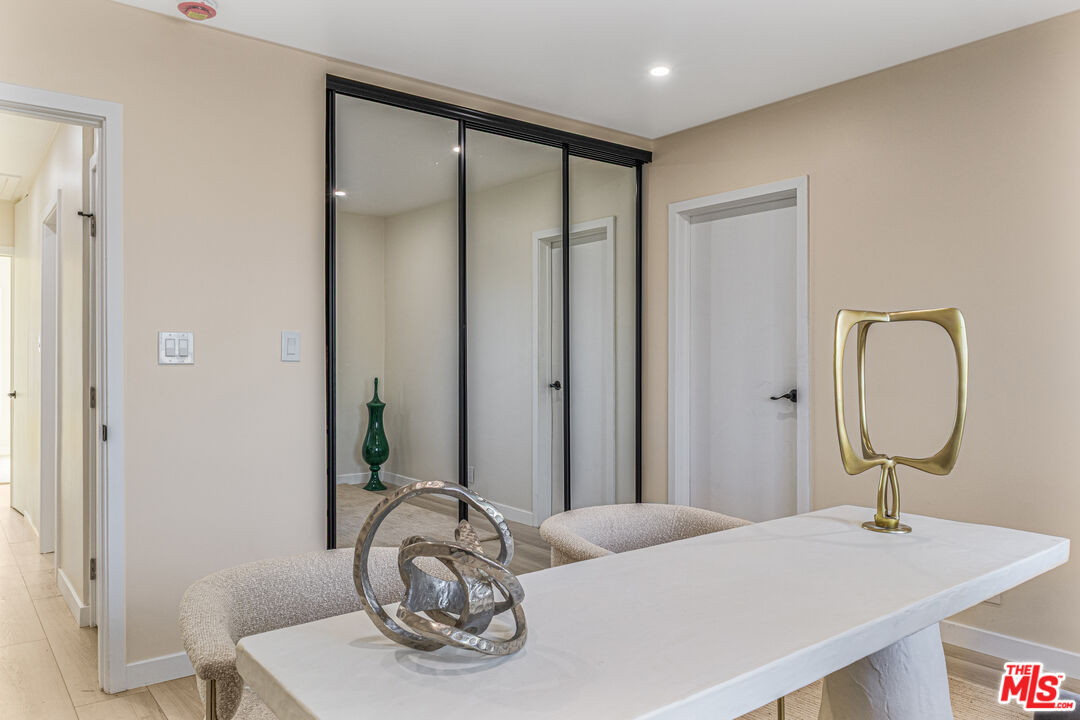 3500 Tuller Avenue Los Angeles, CA 90034 - Photo 17 of 20 a bedroom with a bed and a mirror