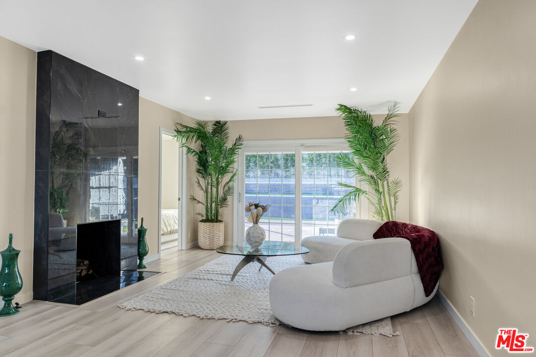 3500 Tuller Avenue Los Angeles, CA 90034 - Photo 2 of 20 a living room with furniture and a fireplace